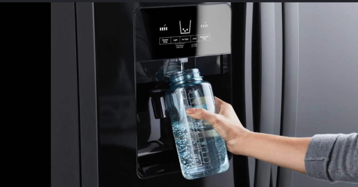 Testing a refrigerator water dispenser repair fix by filling a blue water bottle from a black stainless steel fridge dispenser.